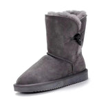 Gray suede snow boot with fur lining on a white background, featuring the brand 'Grug'.