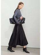 Damen PU Leder Midirock in A-Linie – Eleganter, minimalistischer Winterrock mit lockerer Passform, stilvoller Office- & Commuter-Rock