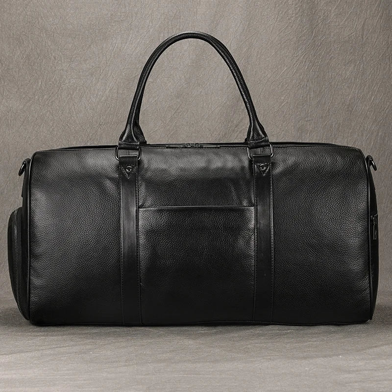 Newsbirds Premium Leder Reisetasche 50 cm - Weiche Cowhide Duffle Bag aus echtem Leder, schwarze Weekend- &amp; Handgepäcktasche für Damen und Herren 