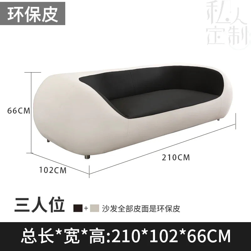 Nordisches Designer Leder-Sofa mit Schlaffunktion – Luxus Lounge Sofa im modernen Stil, geschwungene Relax-Couch aus Rindsleder für Wohnzimmer