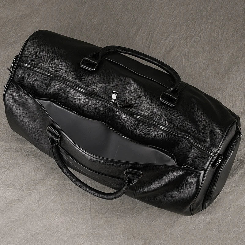 Newsbirds Premium Leder Reisetasche 50 cm - Weiche Cowhide Duffle Bag aus echtem Leder, schwarze Weekend- &amp; Handgepäcktasche für Damen und Herren 